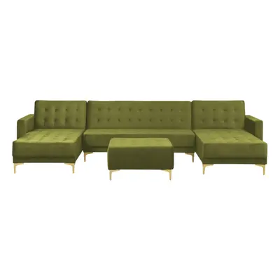 Sofa w kształcie u z ottomaną aberdeen zielony welur symetryczny